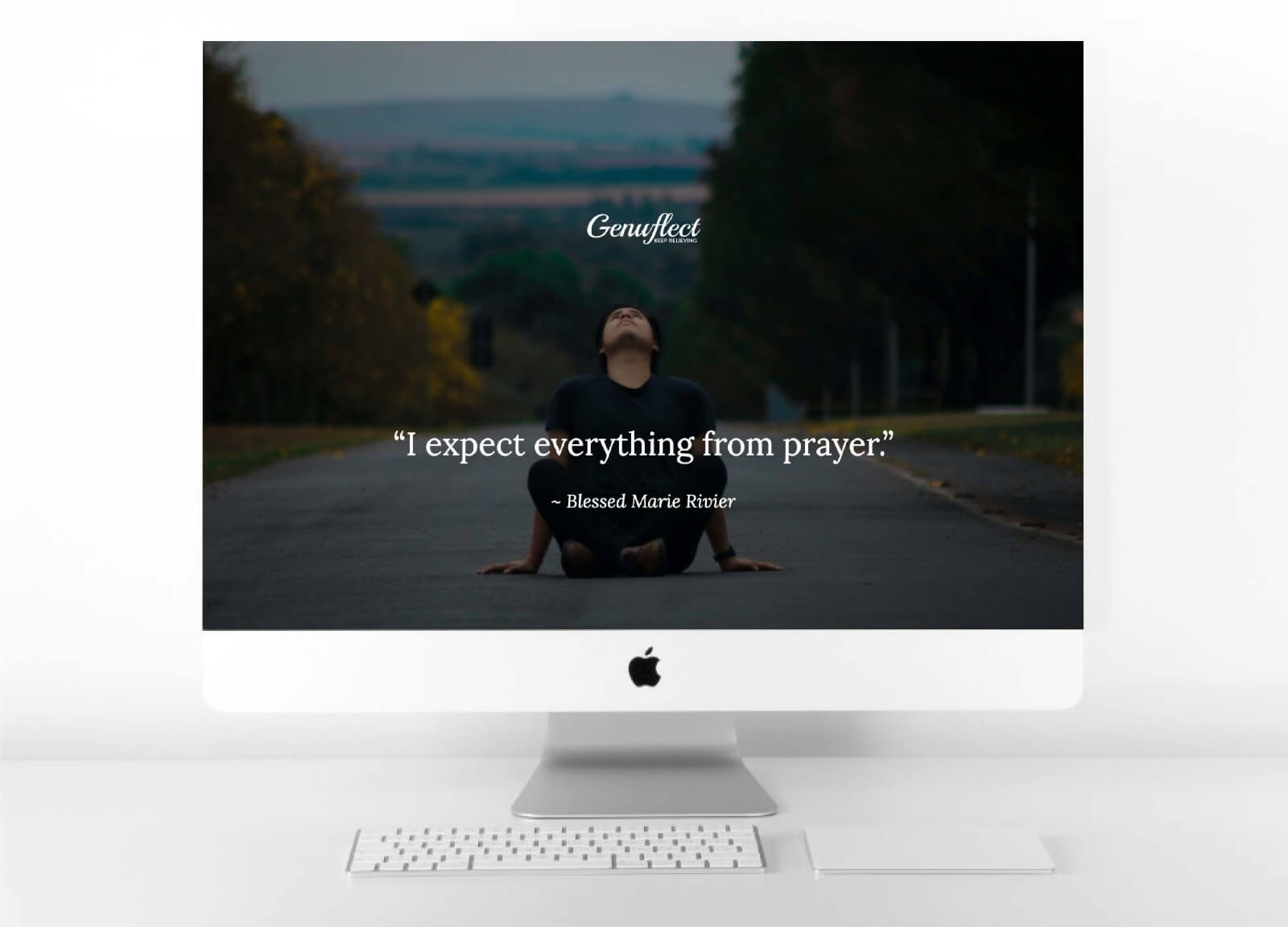Genuflect computer background image of a Guy sitting in the middle of a road looking up to the sky