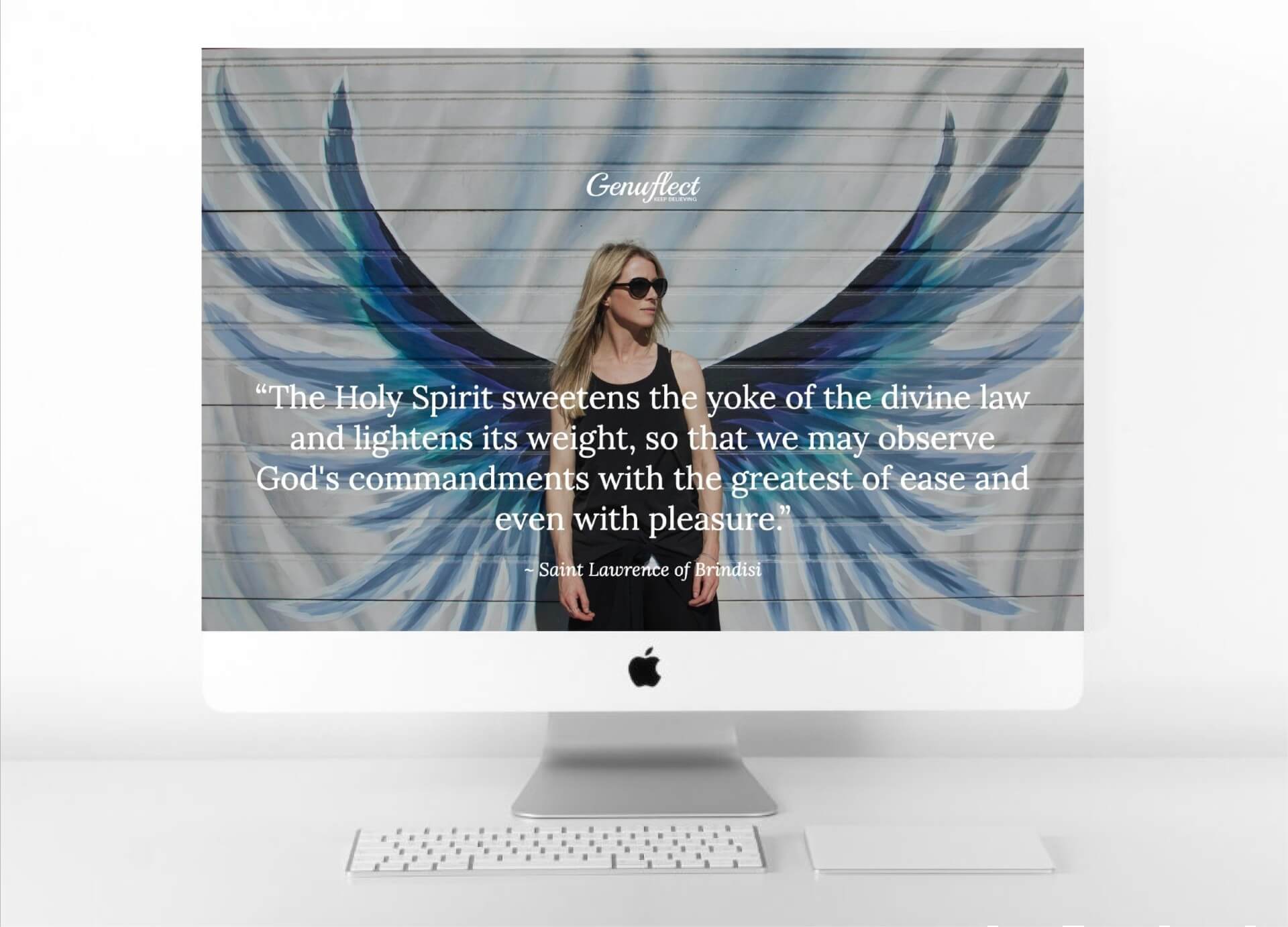 Genuflect computer desktop image of a Woman standing in front of a wall with angel wings painted on it