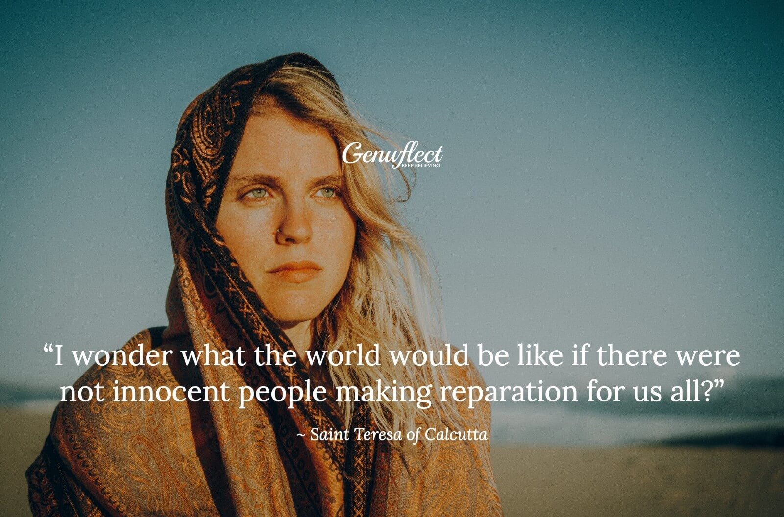 Close up of woman out in the desert with scarf around head and a serious look on her face