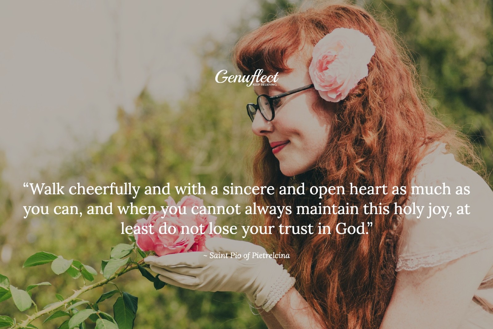 Woman smiling and admiring pink roses in her hands
