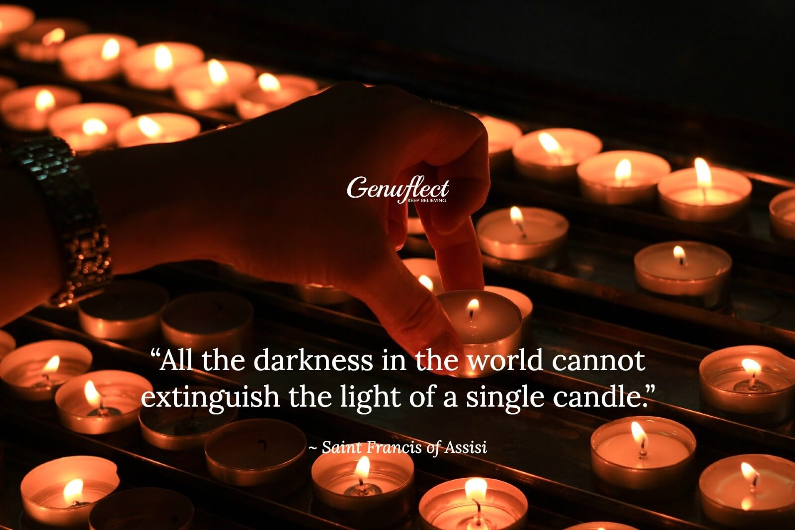 close up of a woman placing a lit tea light in a stand of lit tea lights