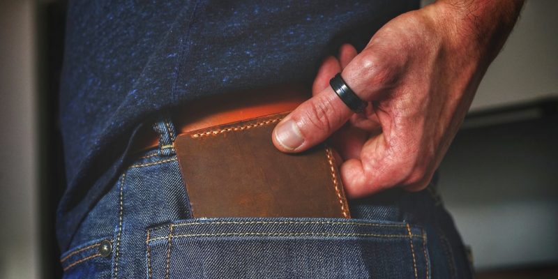 Close up of man's hand removing a wallet from a pocket