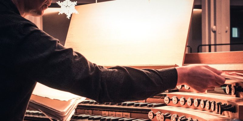 Organist making an adjustment