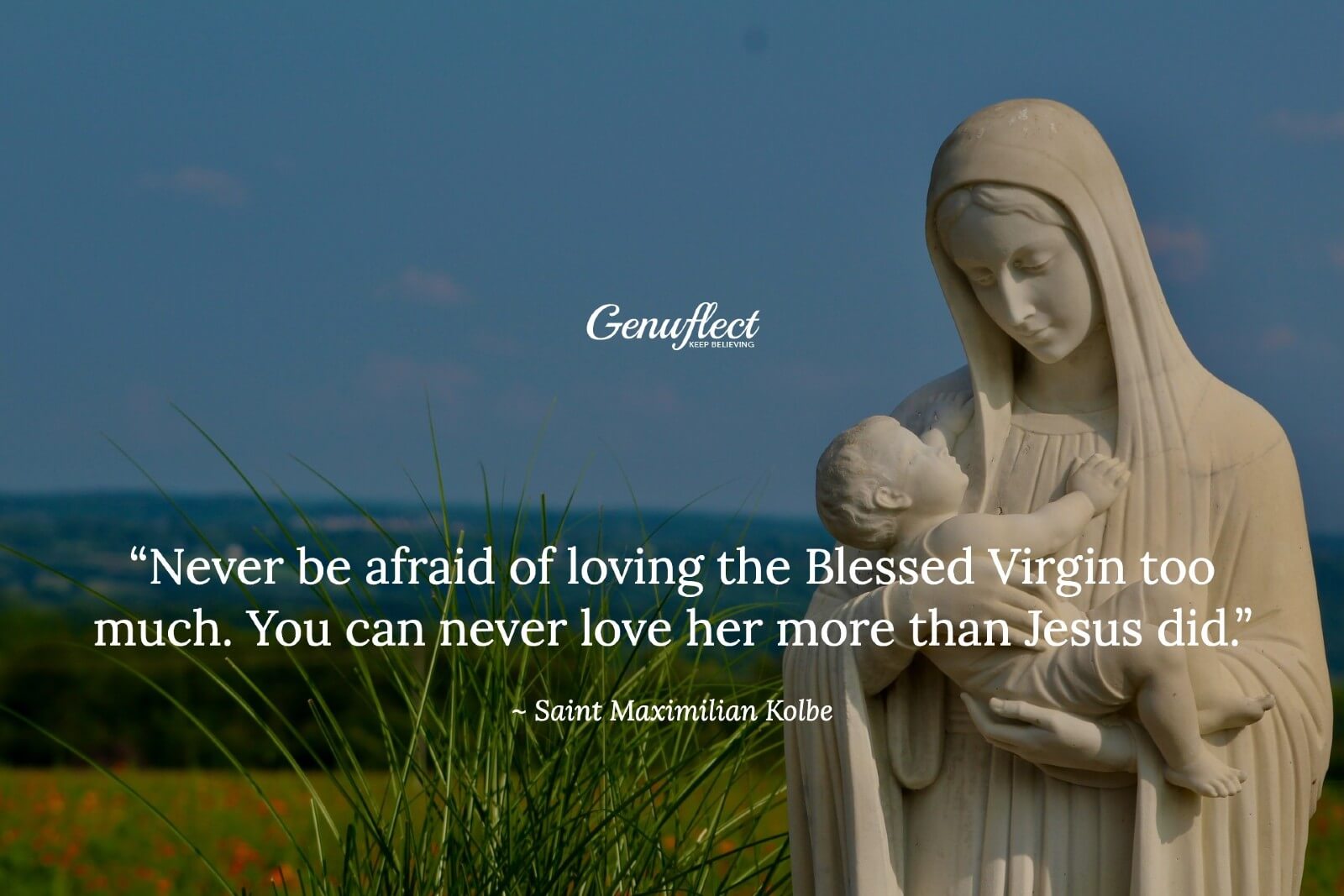 Statue of the Blessed Virgin Mary holding the baby Jesus outside with the ocean in the background