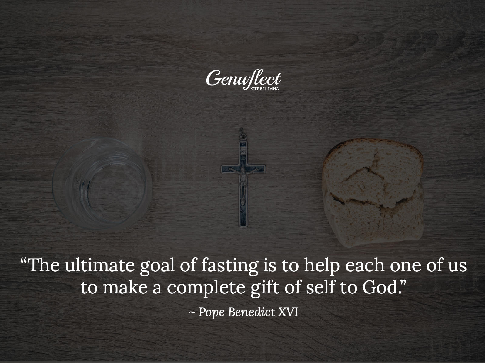 Bread, water and a crucifix sitting on a table
