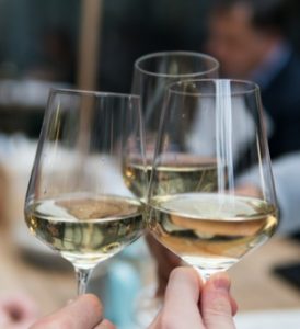 a toast with wine glasses