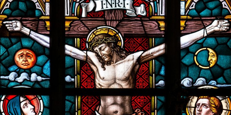 Stained glass window of crucified Jesus