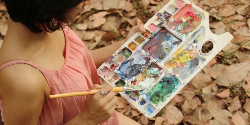 Woman holding a paint palette