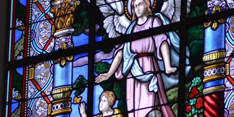 Stained glass window of guardian angel