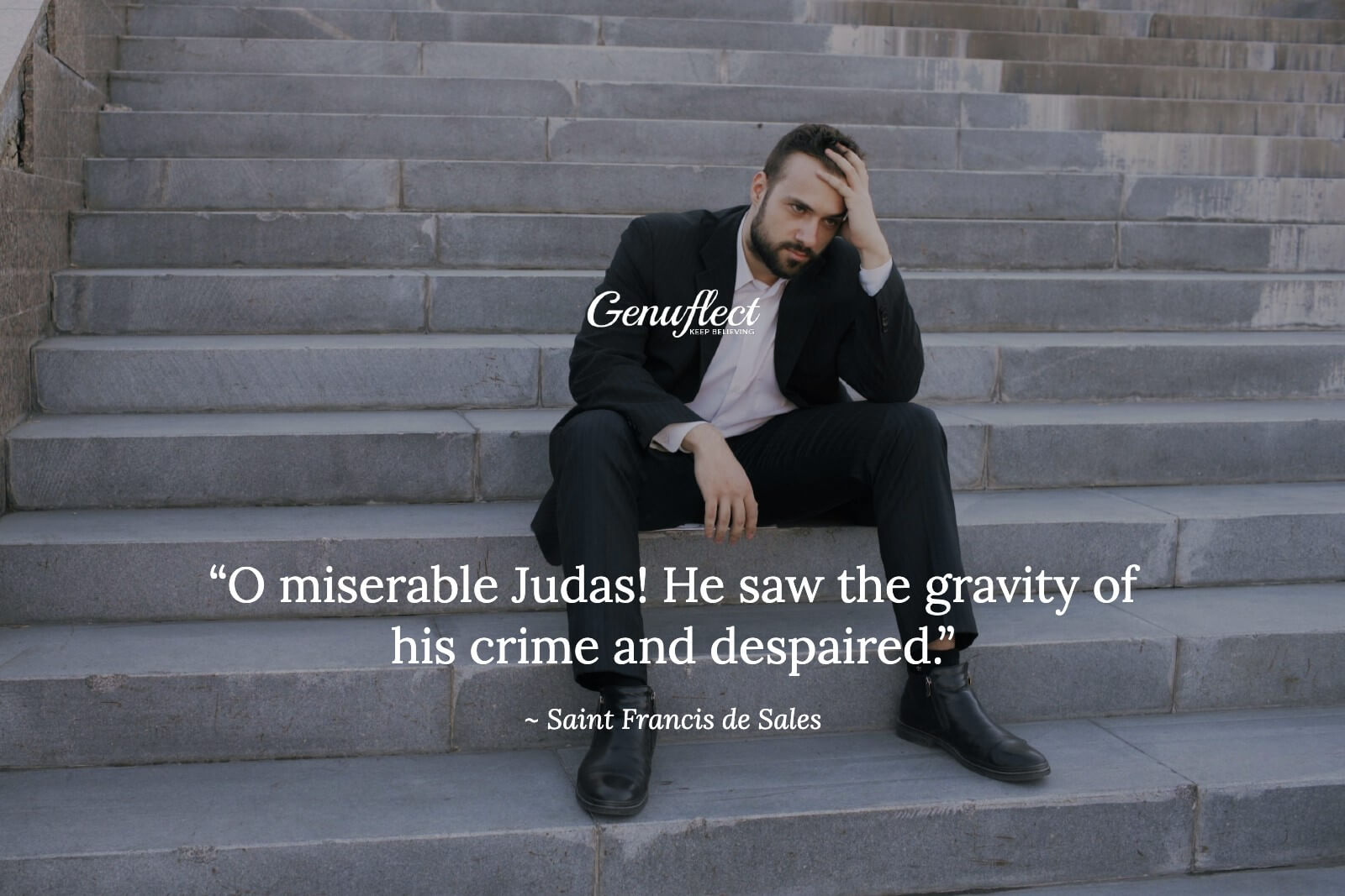 Man sitting on steps outside with his hand on his head in despair