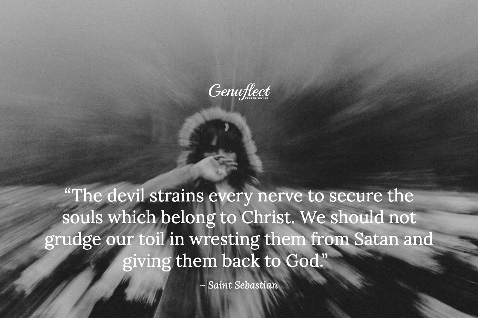 Black and white image of a person with hand over mouth and background blurred.